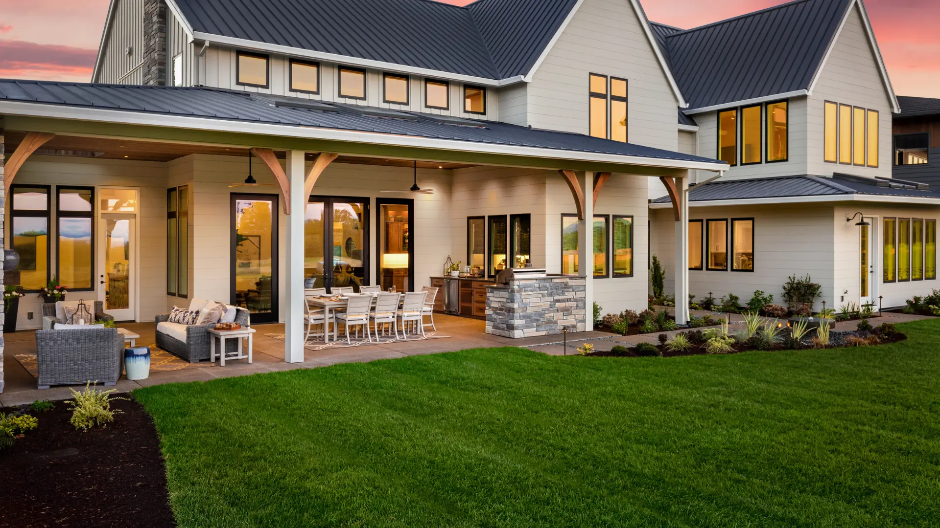 Outdoor living space with patio and firepit built by Solid Rock